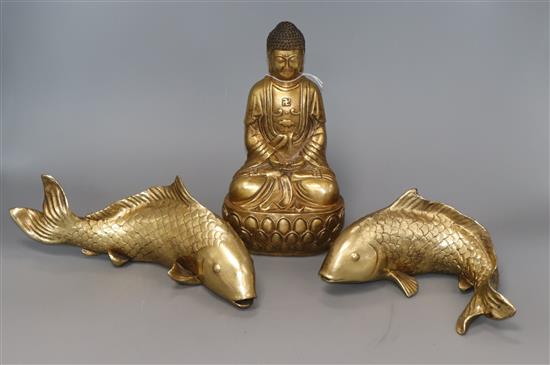 An Eastern gilt metal Buddha and a pair of resin carp Buddha 24cm